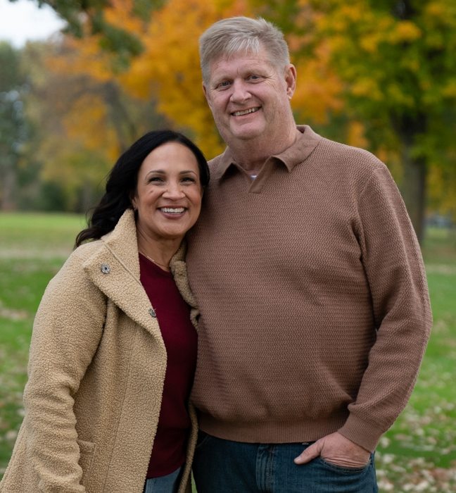Lisa Demuth pictured beside a man outdoors — photograph from her campaign homepage