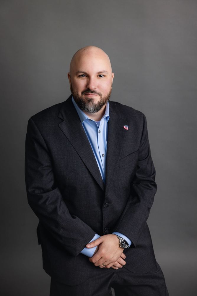 Steven Shook — campaign photograph; group and family photographs are retained as sourced