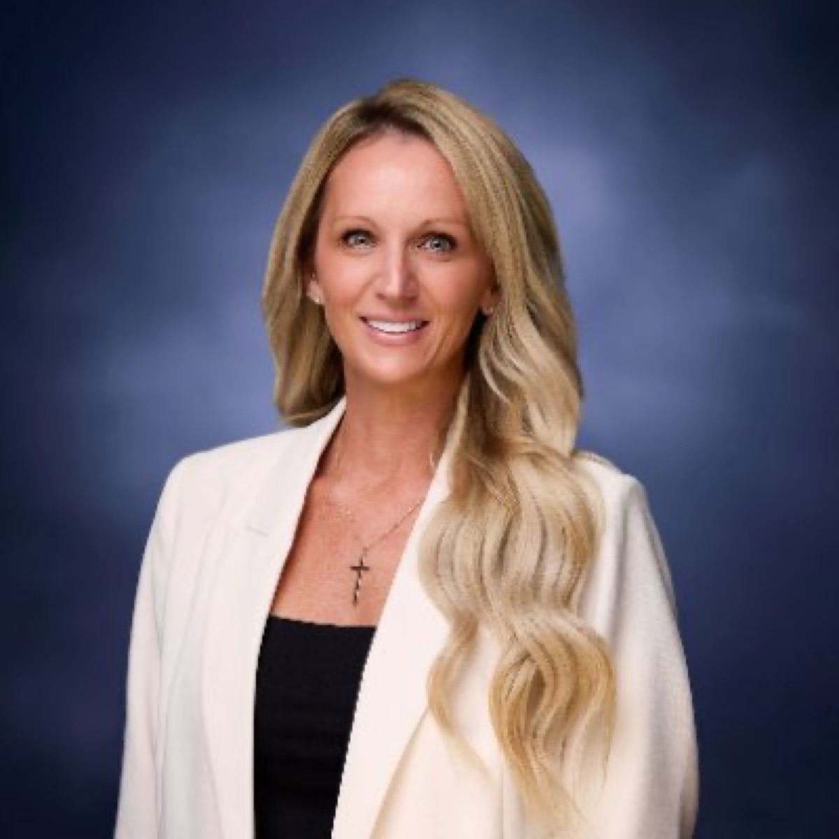 Victoria Hinojosa in her official campaign portrait against a blue background